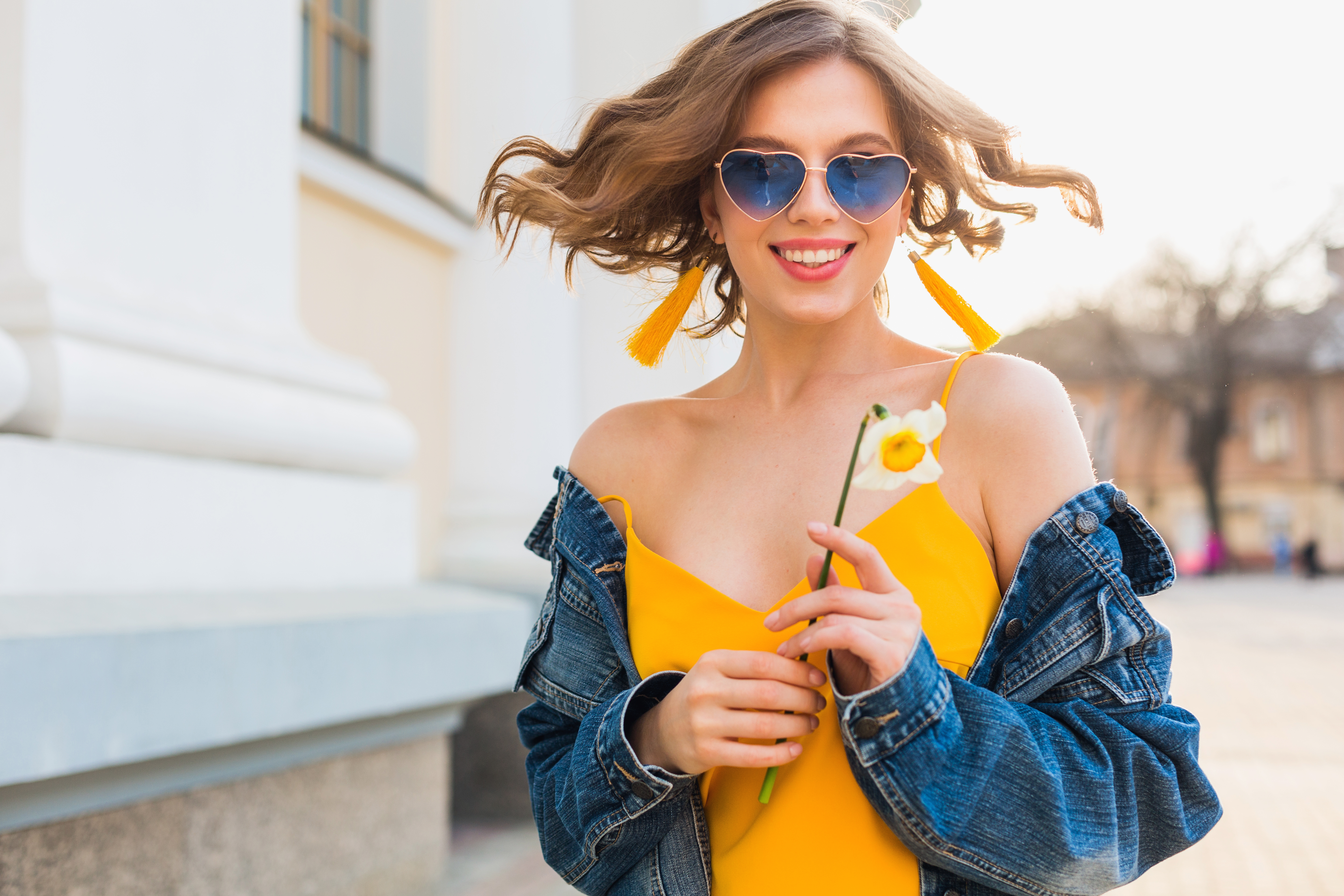 A Woman with a Yellow Dress and Denim Jacket